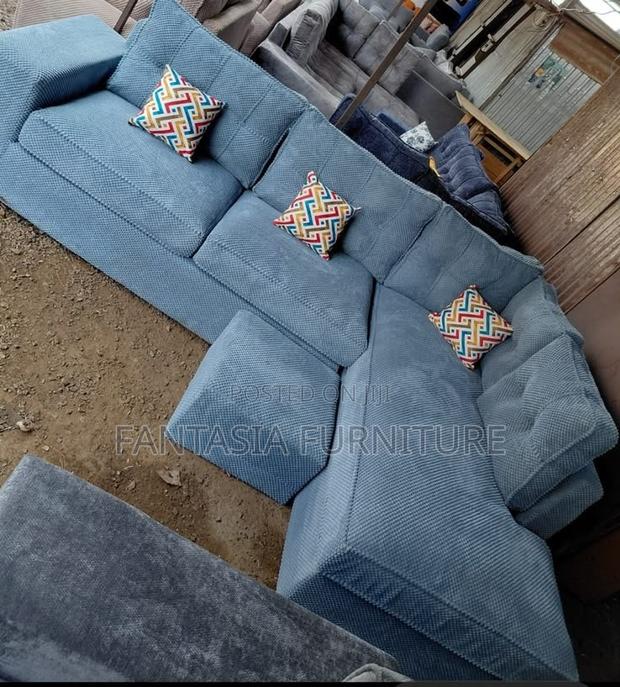 5 Seater Light Grey Textured Chaise Sofa + Footrest