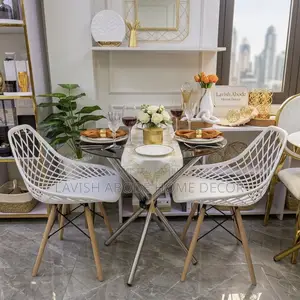 Round Clear Tempered Glass Silver Table With 2 White Mesh Eames Chair
