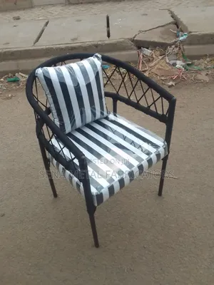 Black and White Outdoor Woven Chair With Polythene Protective Finish.