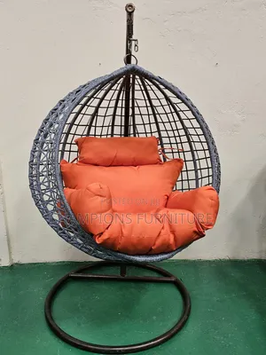 Grey Rattaj Swing Egg Chair With Orange Cushions