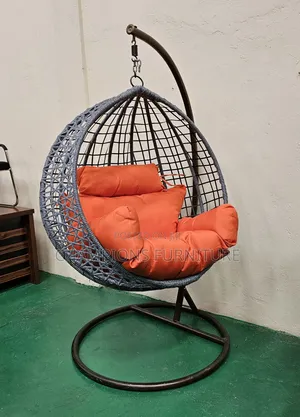 Grey Rattaj Swing Egg Chair With Orange Cushions