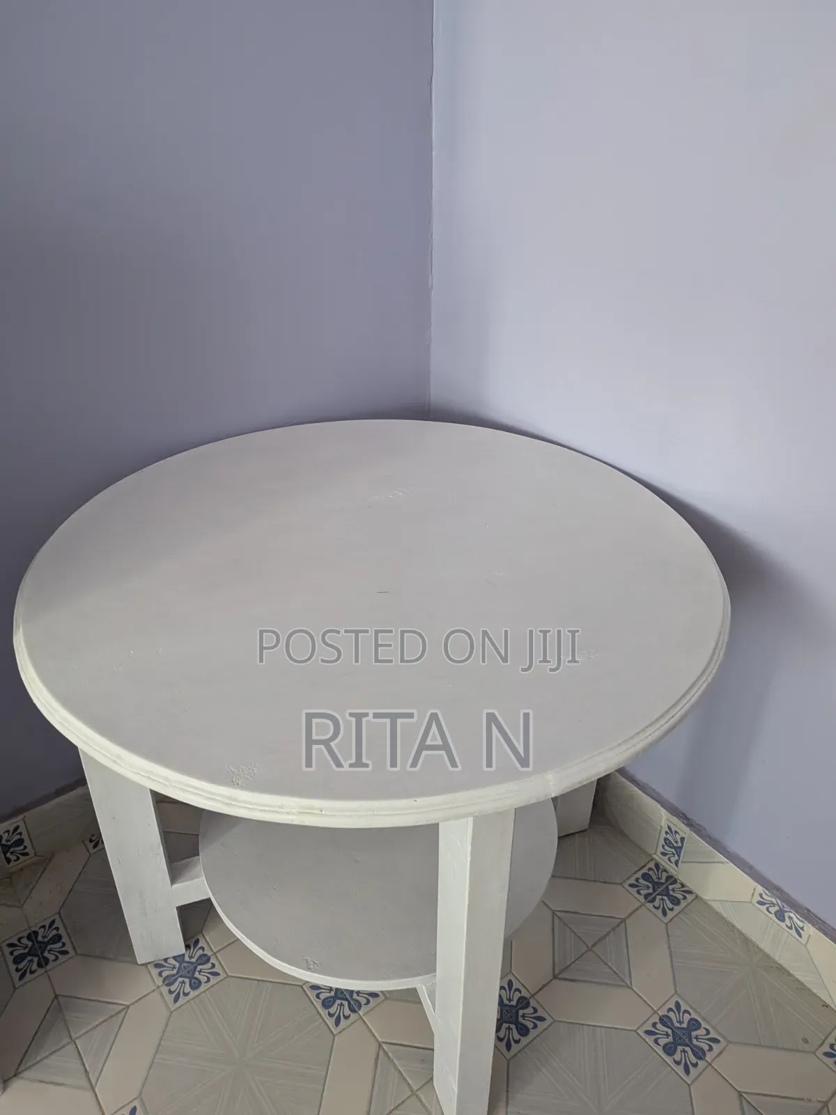 A Small White Wooden Table Perfect for a Living Room Setting