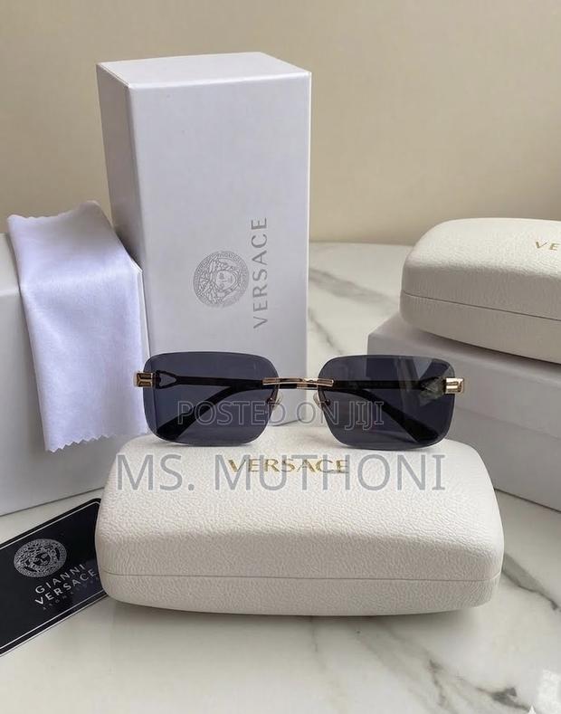 The Versace VE2298 Rectangle Sunglasses Ft a Gold-Tone Rimless Frame