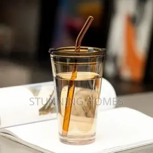Glass Tumbler With a Sleeve and Straw