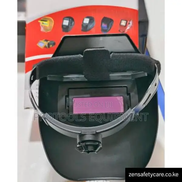 Auto-darkening welding shield