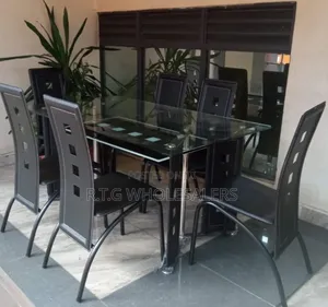 Executive 6 Sitter Glass Dinning Table With Leather Seat at 