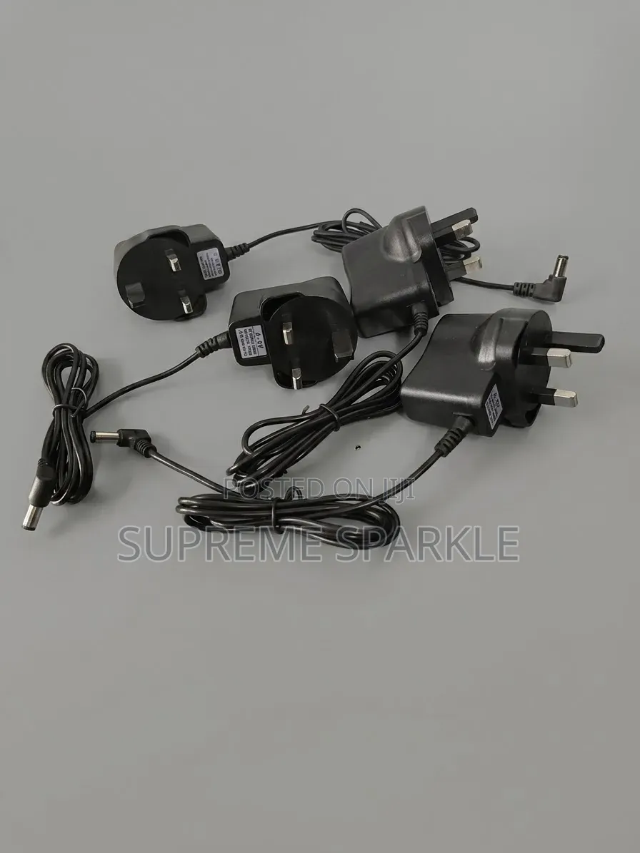 AC DC 3-Pin Power Adapter Battery Charger. Output DC 6.0V / 1000mA