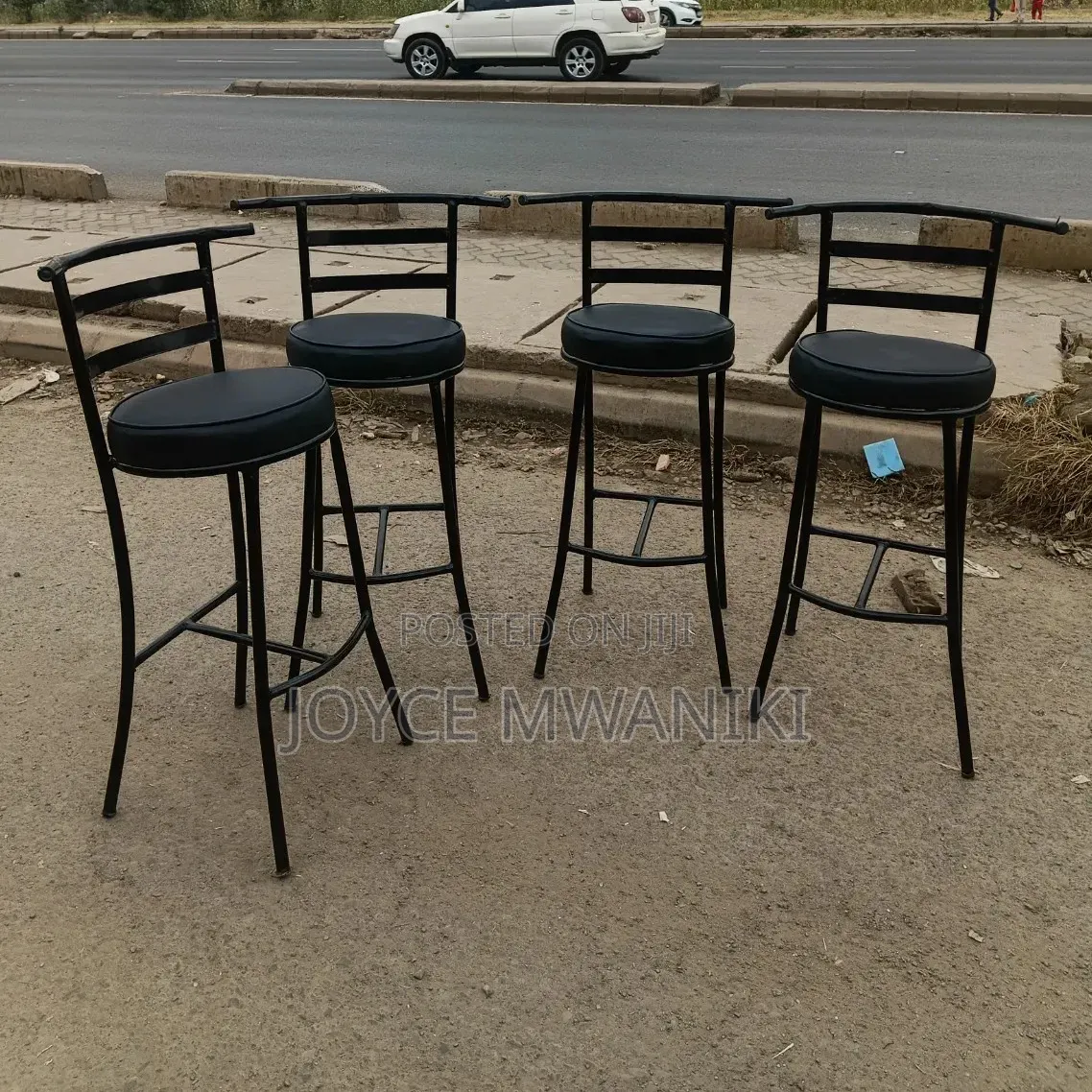 High Round Bar or Counter Stools With Black Metal Frame..