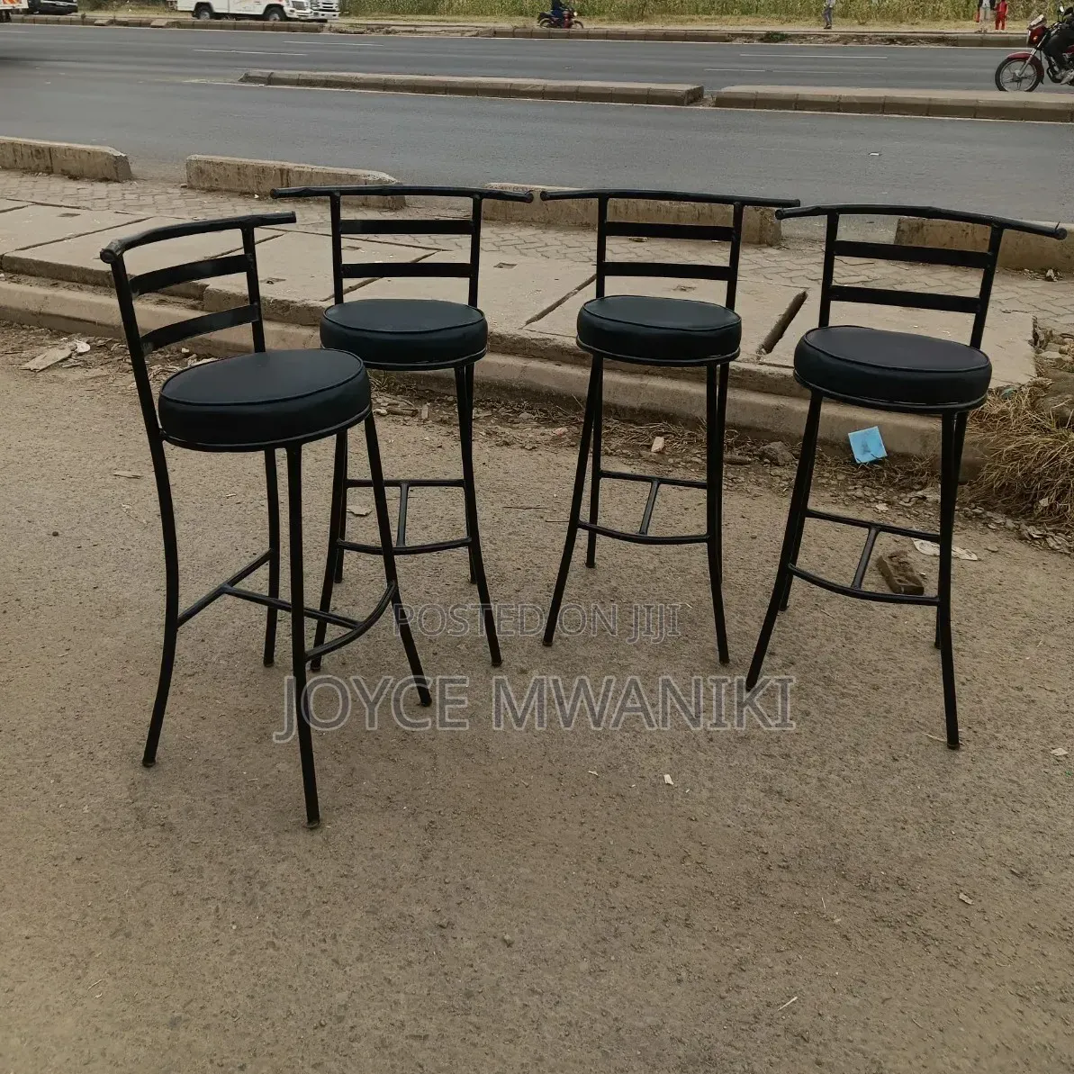 High Round Bar or Counter Stools With Black Metal Frame..