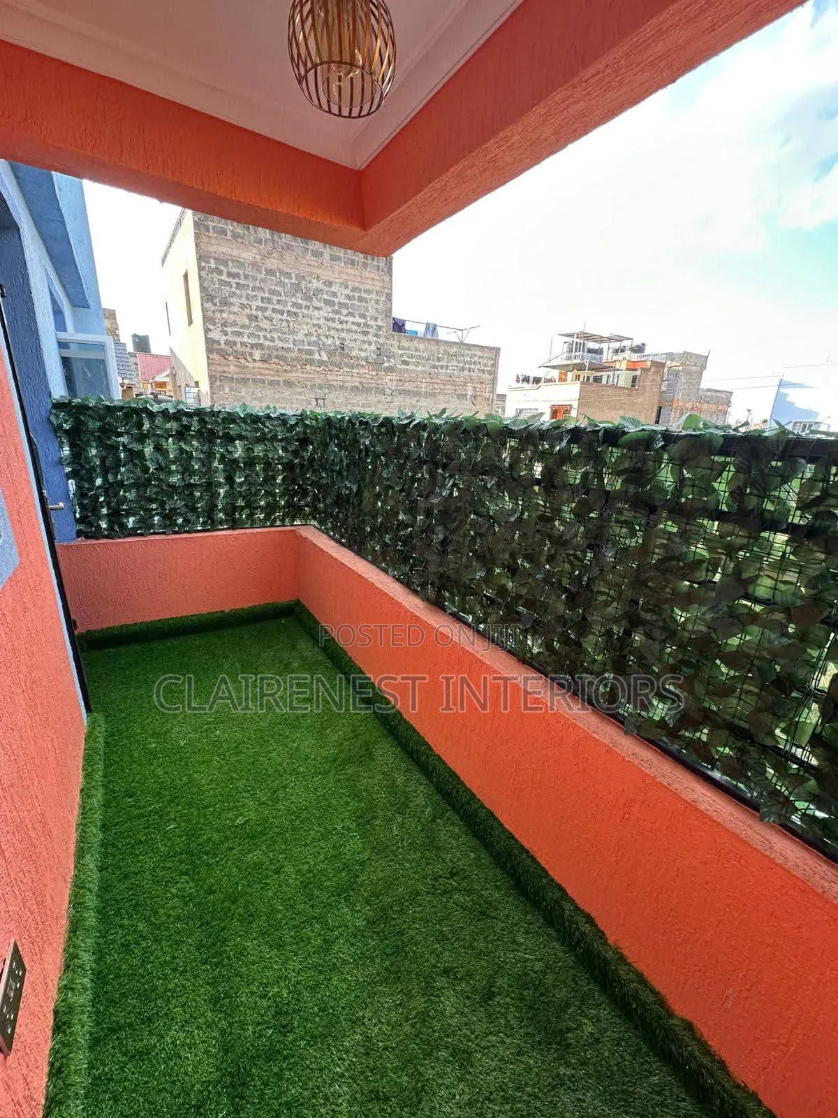 Create an Elegant Green Enclosure With Artificial Grass