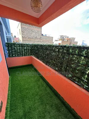 Create an Elegant Green Enclosure With Artificial Grass