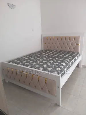 5 by 6 White and Beige Bed