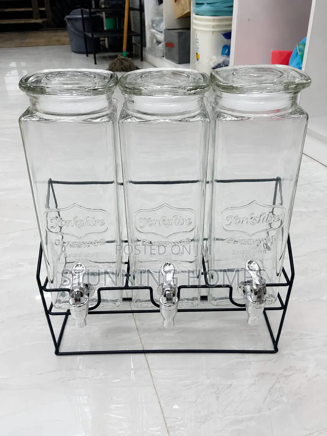 Triple Glass Juice Dispenser With a Metallic Stand
