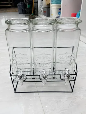 Triple Glass Juice Dispenser With a Metallic Stand