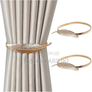 A Pair of Feather Shaped Elastic, Metallic Curtain Buckles @Gale