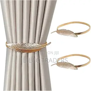 A Pair of Feather Shaped Elastic, Metallic Curtain Buckles @Gale