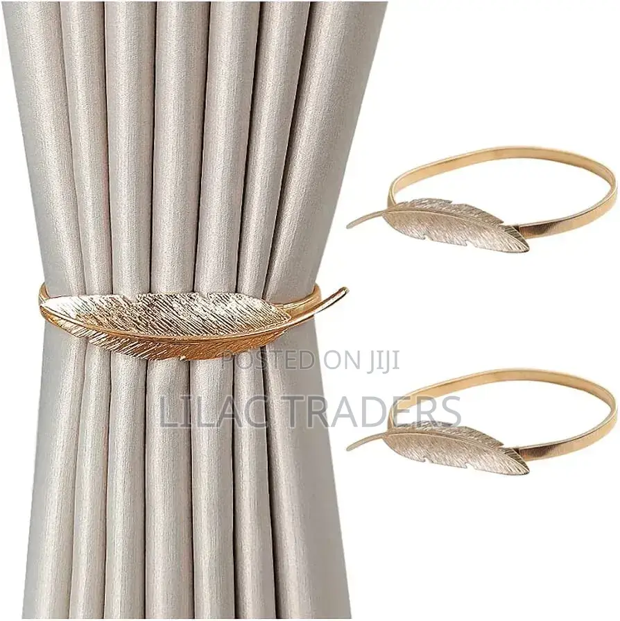 A Pair of Feather Shaped Elastic, Metallic Curtain Buckles @Gale