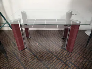 Sleek Glass Top Dining Table With Bottom Shelf