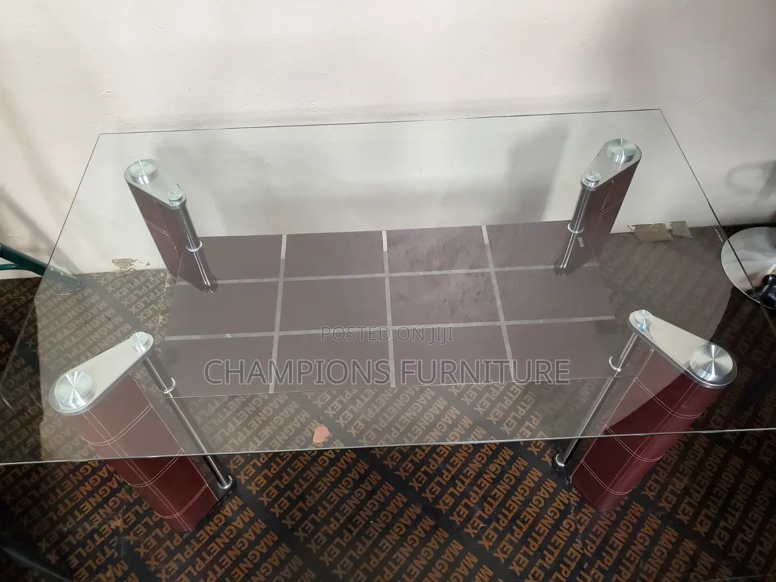 Sleek Glass Top Dining Table With Bottom Shelf