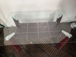 Sleek Glass Top Dining Table With Bottom Shelf