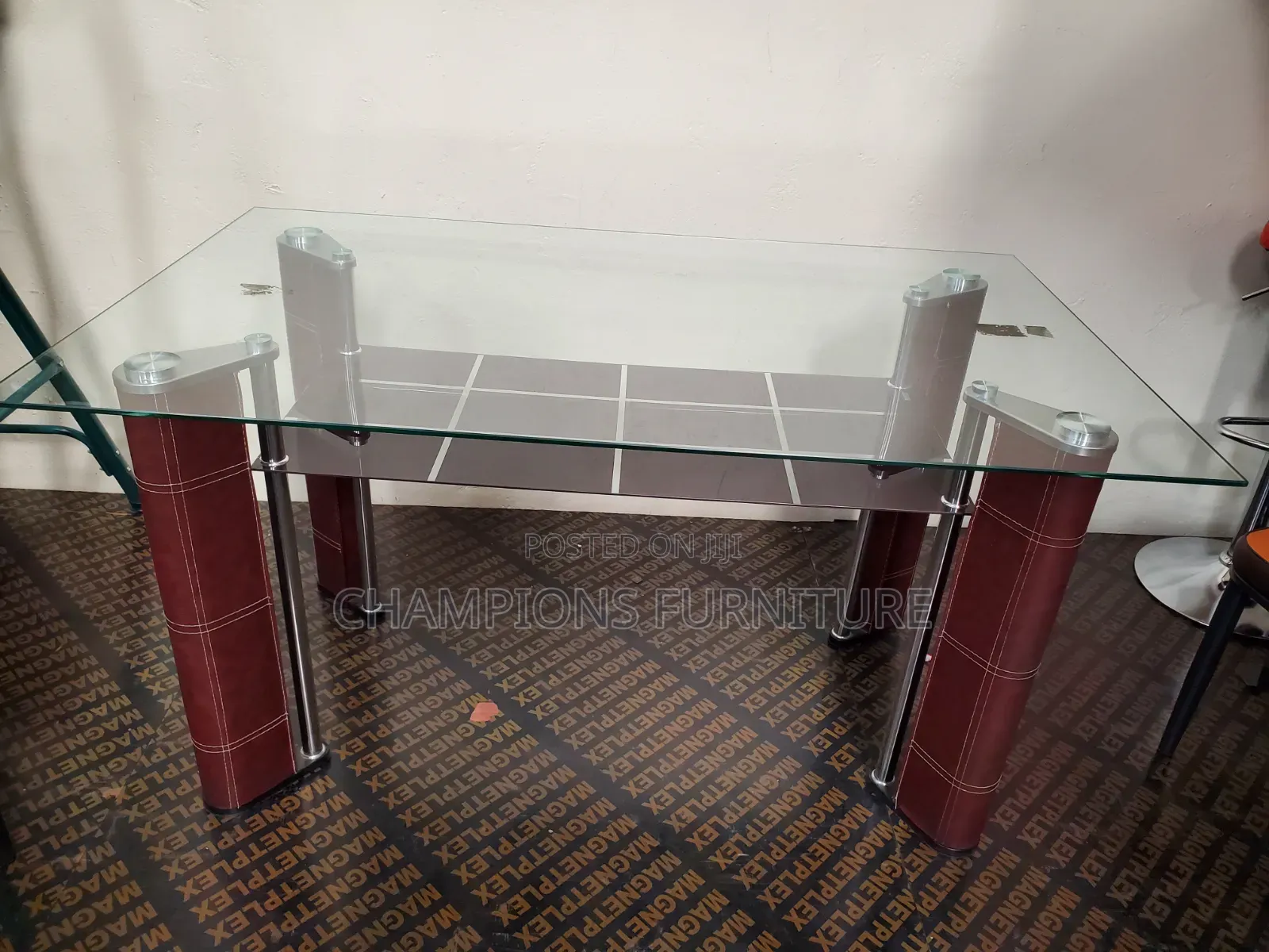 Sleek Glass Top Dining Table With Bottom Shelf