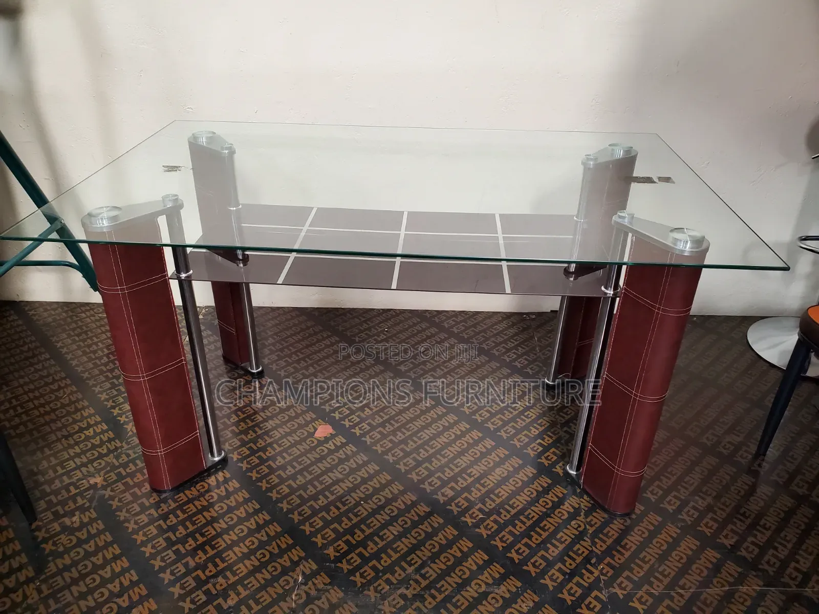 Sleek Glass Top Dining Table With Bottom Shelf