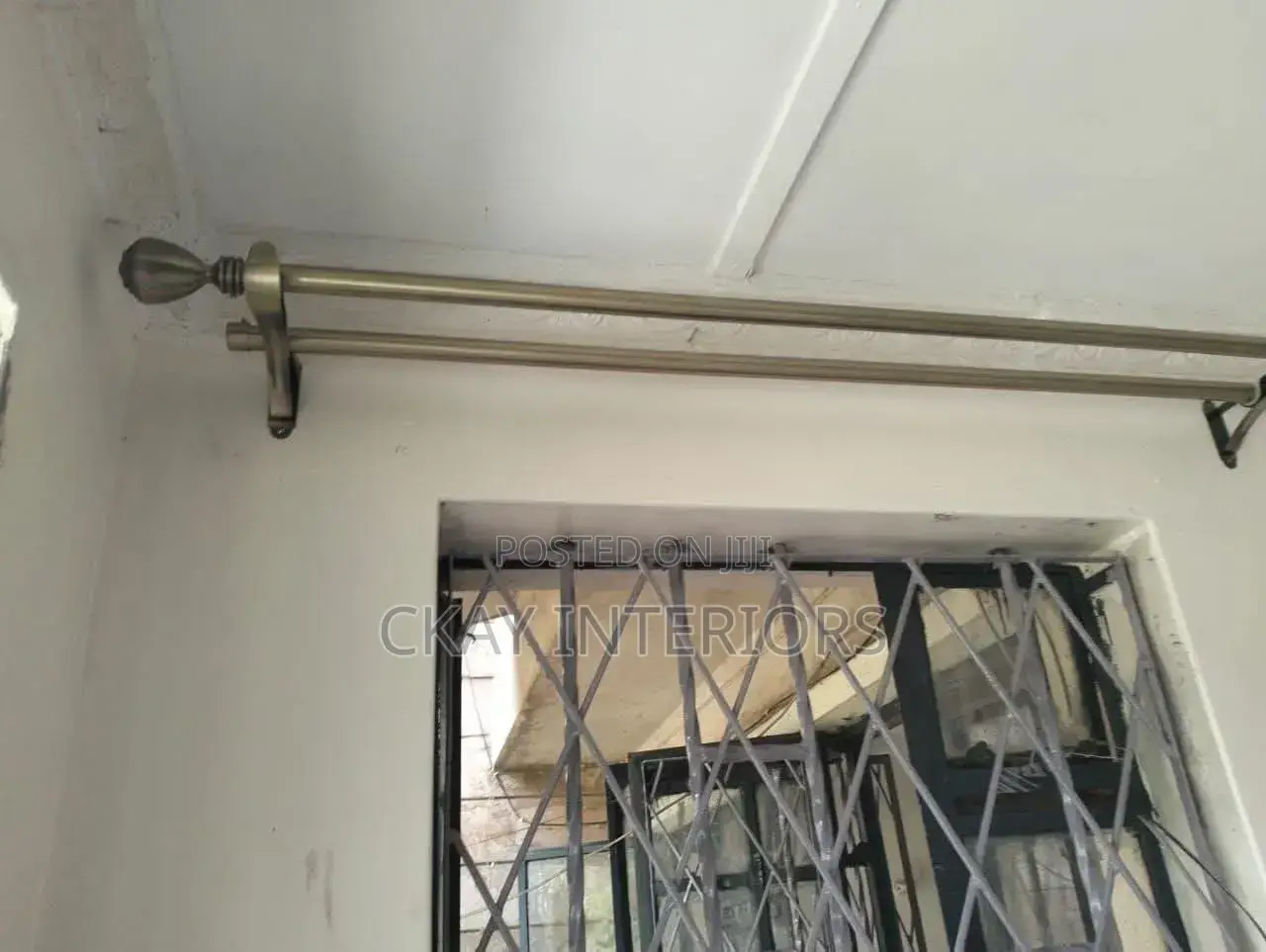 Antic and Black Stylish Rods for Polished Curtain Setups.