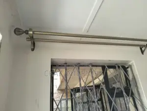 Antic and Black Stylish Rods for Polished Curtain Setups.