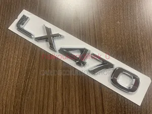 Chrome LX470 Lettering Decal Badge Mounted in Rear Trunk
