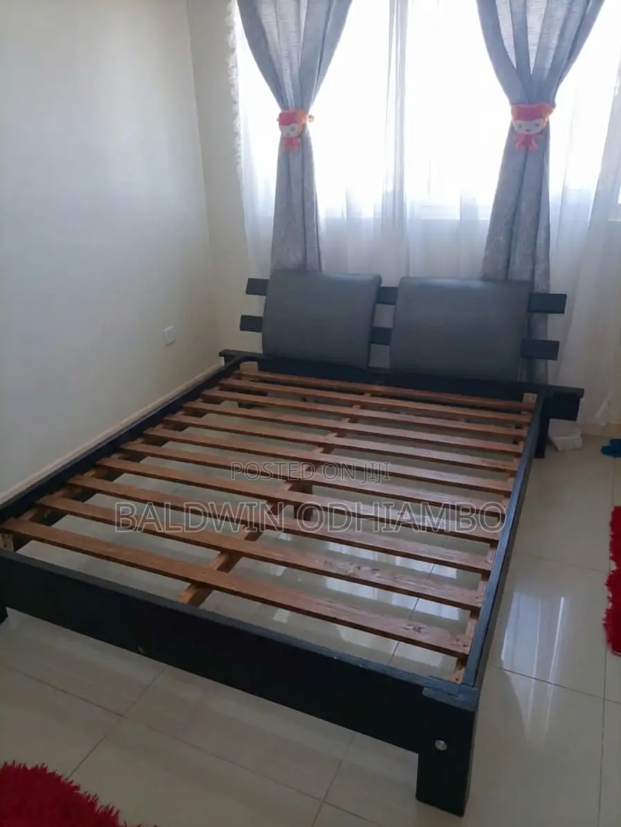 Clean 5x6 Wooden Bed With Padded Headboard Backings