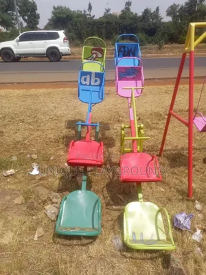Outdoor Kids Play Seesaws and Swings