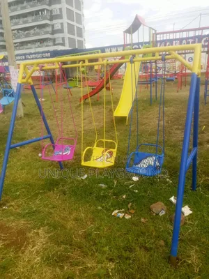 Playground Equipment Swings Slides and Seesaw