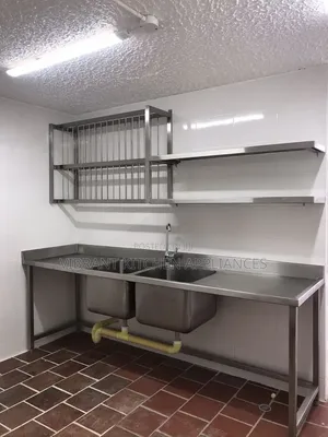 Full-Length Commercial Sink With Two Stainless Steel Wall Shelves