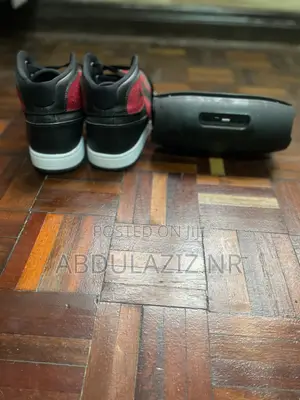 Black/Red High-Top Sneakers and AERBES Bluetooth Speaker