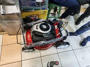 Petrol Lawn Mower Machine – Powerful Grass Cutting Equipment