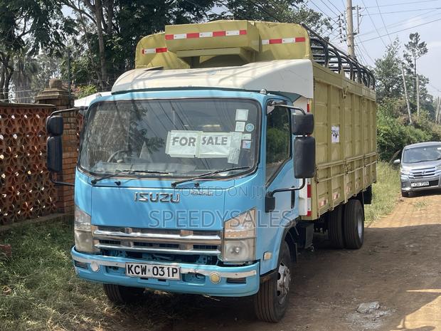 Isuzu NKR 75 Cargo Truck - thumbnail 2