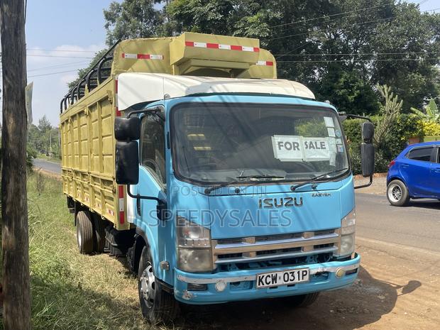 Isuzu NKR 75 Cargo Truck - thumbnail 3