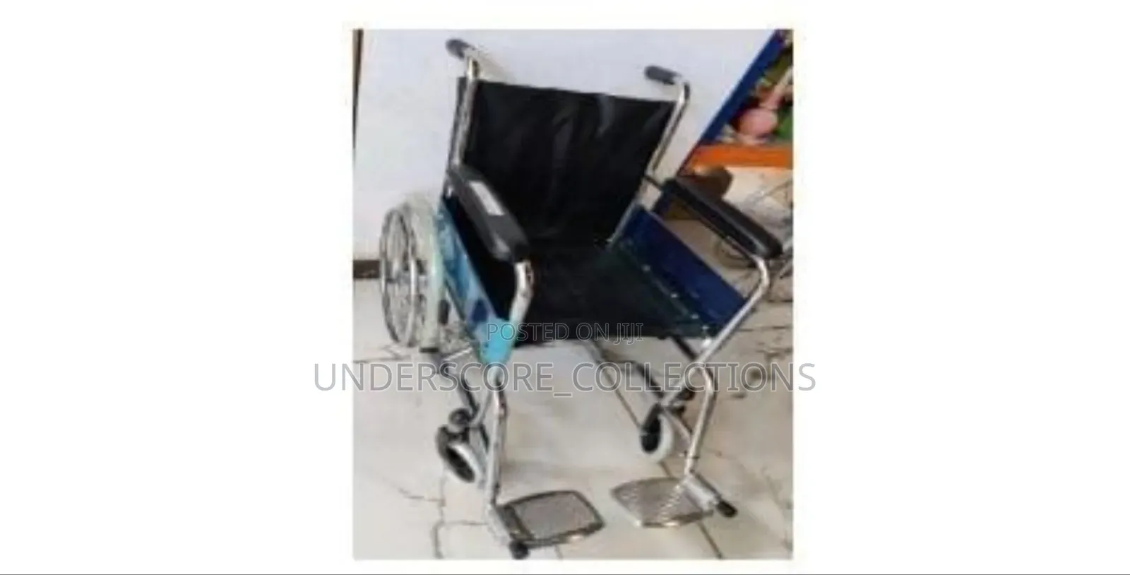 Standard Foldable Manual Wheelchair With a Metal Frame and Black Seat