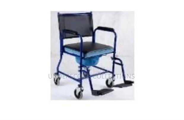 Blue Steel Commode Wheelchair With a Padded Seat, Backrest
