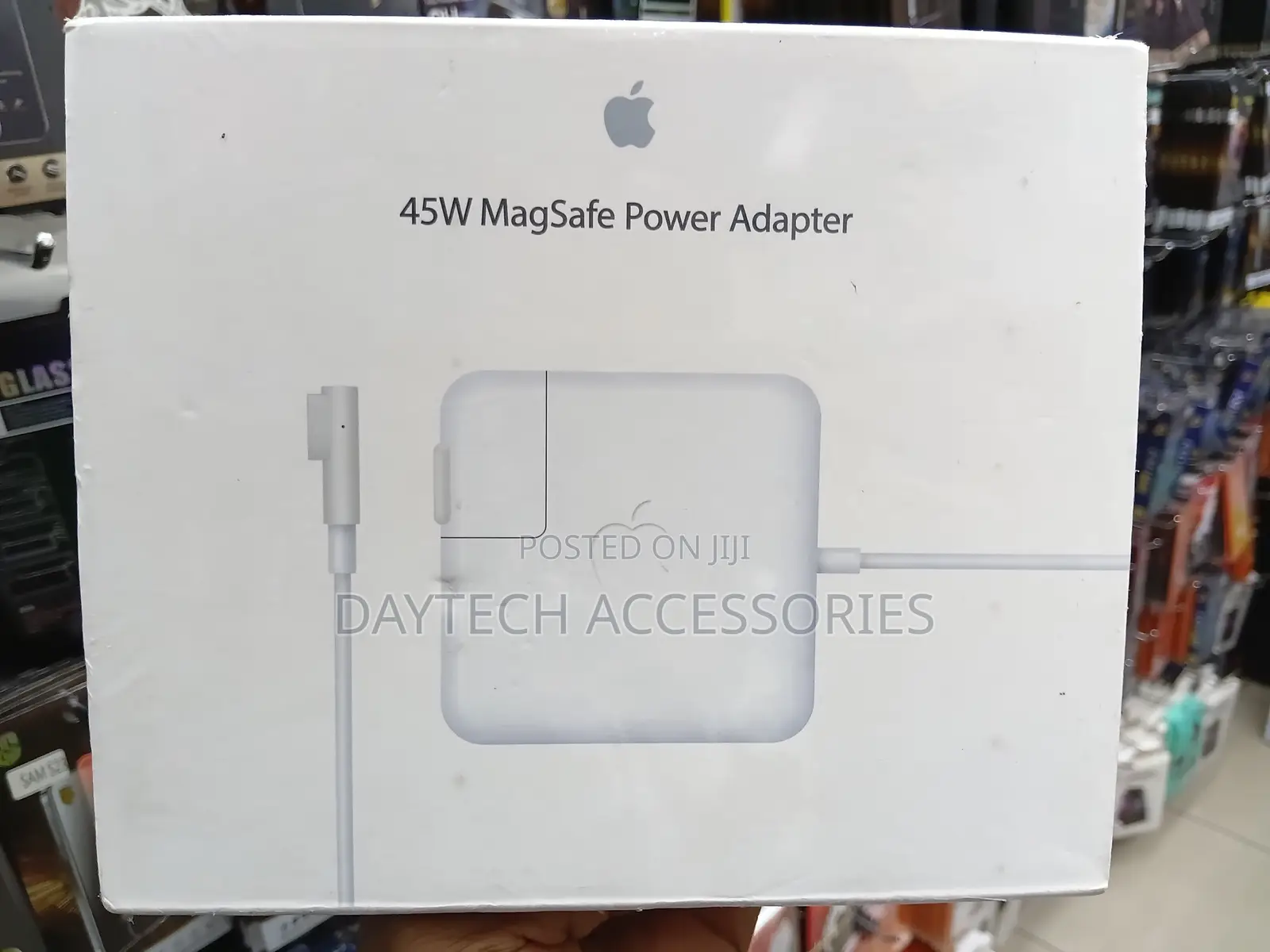 An Apple 45W MagSafe Power Adapter L-Shaped - White.