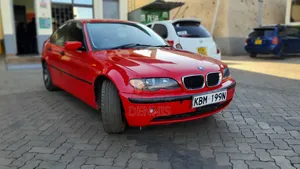 BMW 320i Sedan RWD 2004 Red