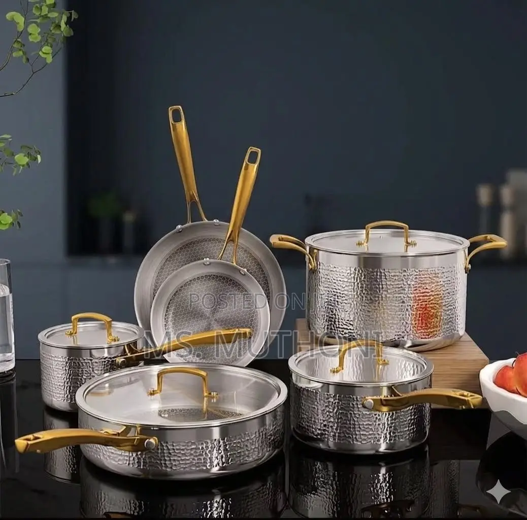 Tri-Ply Hammered Stainless Steel Cookware Set With Gold Handles.