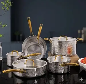 Tri-Ply Hammered Stainless Steel Cookware Set With Gold Handles.