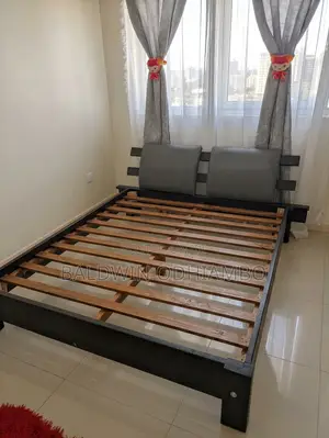 Clean 5x6 Wooden Bed With Padded Headboard Backings