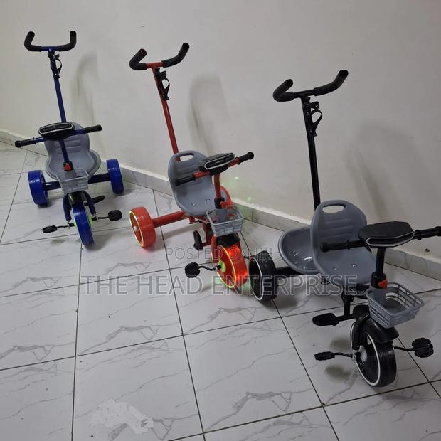 Kids Try Cycle With a Push Handle