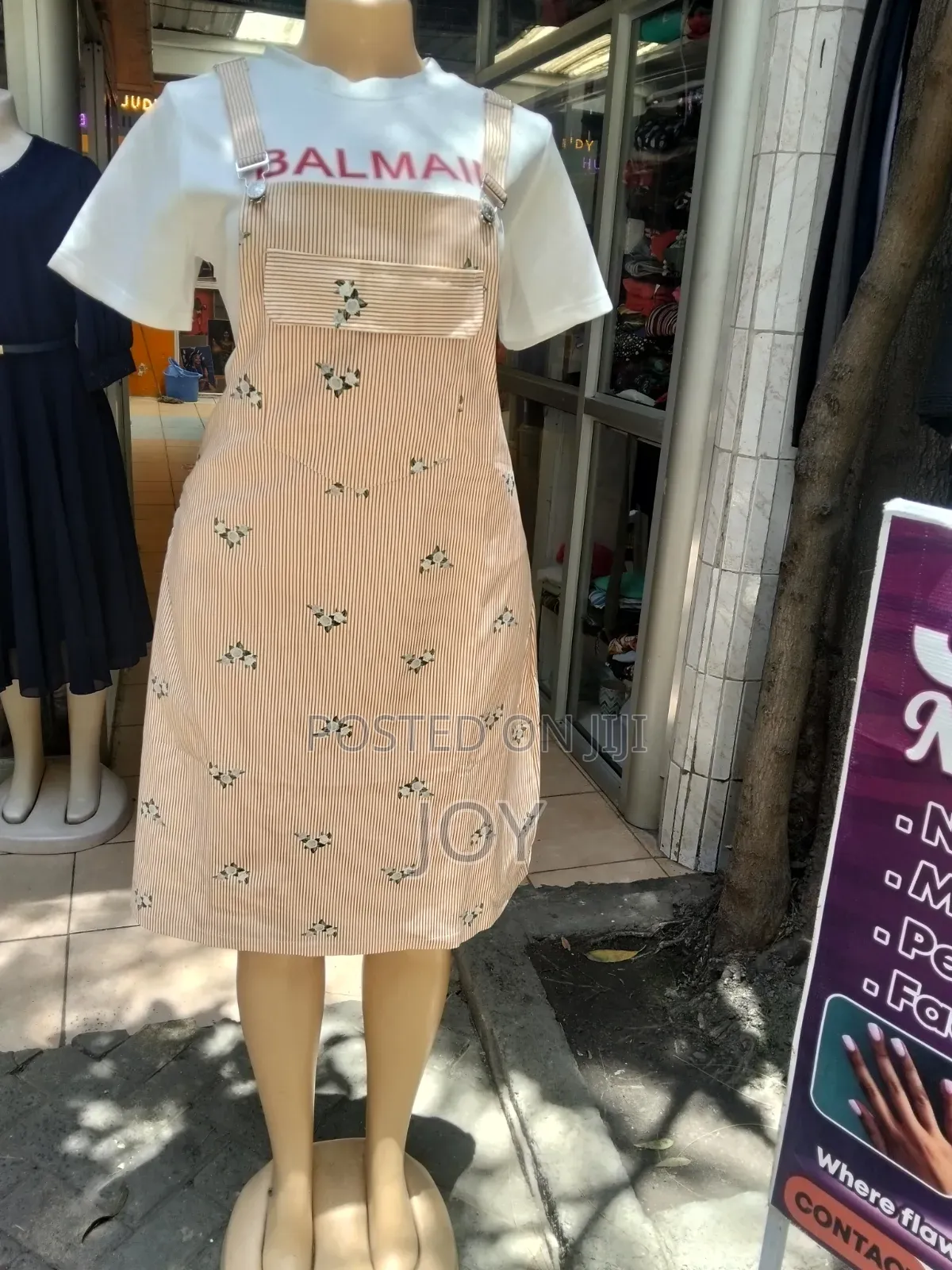 An Orange Pinstriped Pinafore Dress