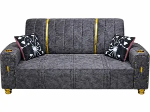 Channel-Tufted Velvet Glam Sofa With Cup Holders and Gold Accents.