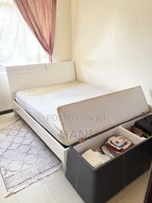 Second -Hand 5by6 Wooden Bed Olus Ottoman Plus Matteress