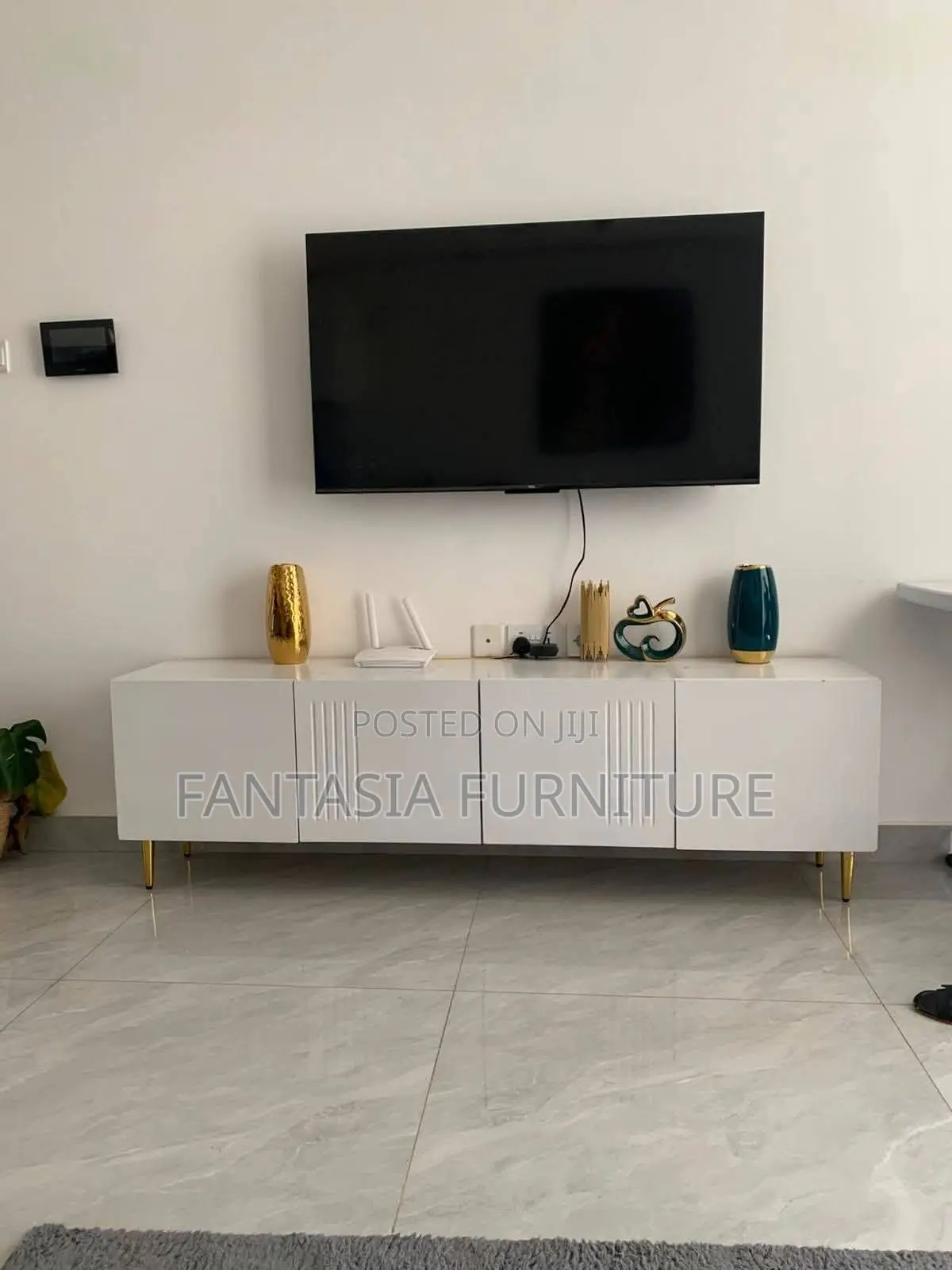 Minimalist White TV Console With Gold Legs