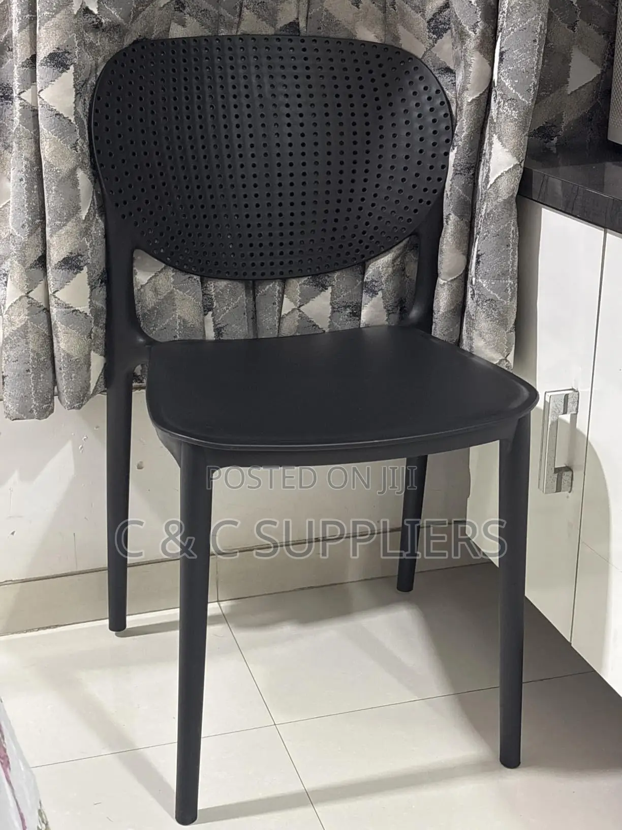 Black Plastic Armless Dining Chair.